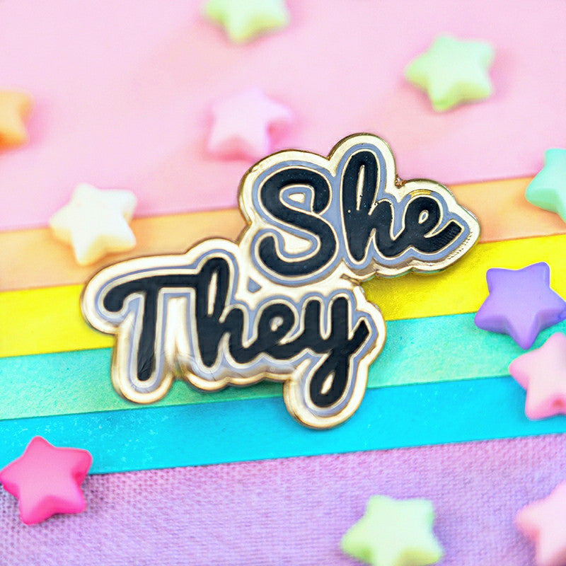 She/They Pin (Black Glitter)